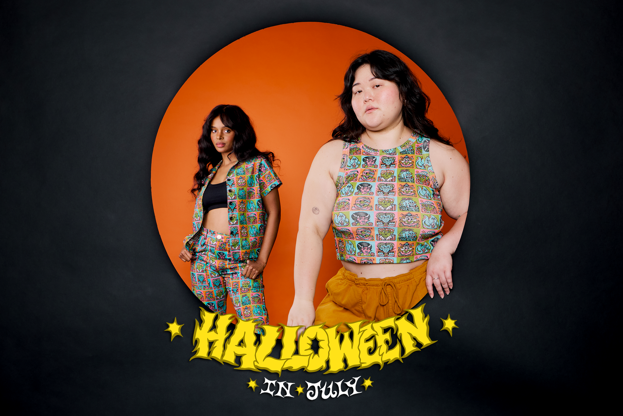 Ashley is wearing the racerback tank in halloween icons. Kandia is in the background wearing the Pantry Button-up and Work Pants in Halloween Icons
