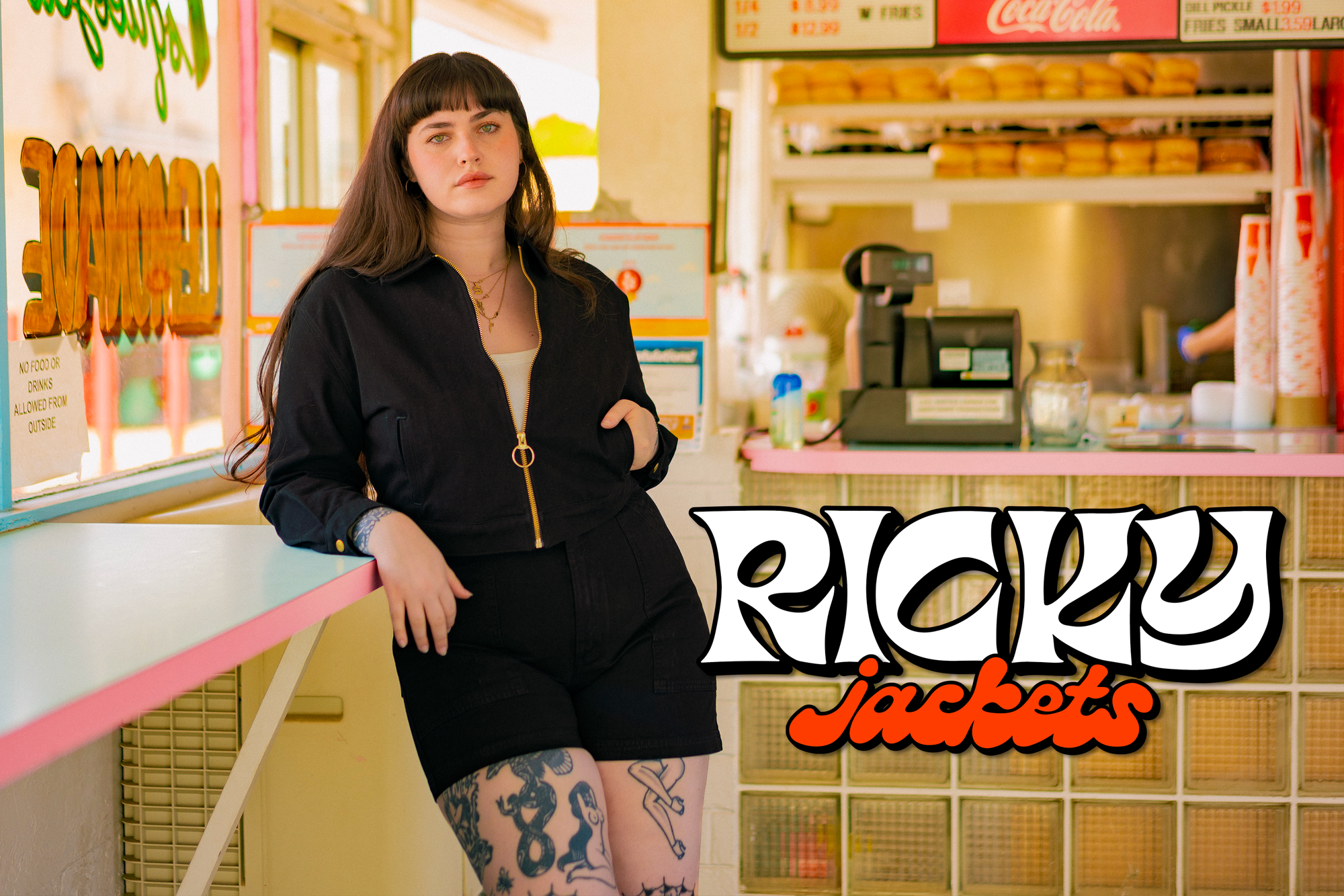 Sydney is wearing the Ricky Jacket in Black and Work Shorts in Black