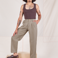 Jesse is 5'8" and wearing XS Heritage Trousers in Khaki Grey paired with espresso brown Tank Top
