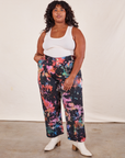 Morgan is 5'5" and wearing 1XL Rainbow Magic Waters Work Pants paired with vintage off-white Tank Top