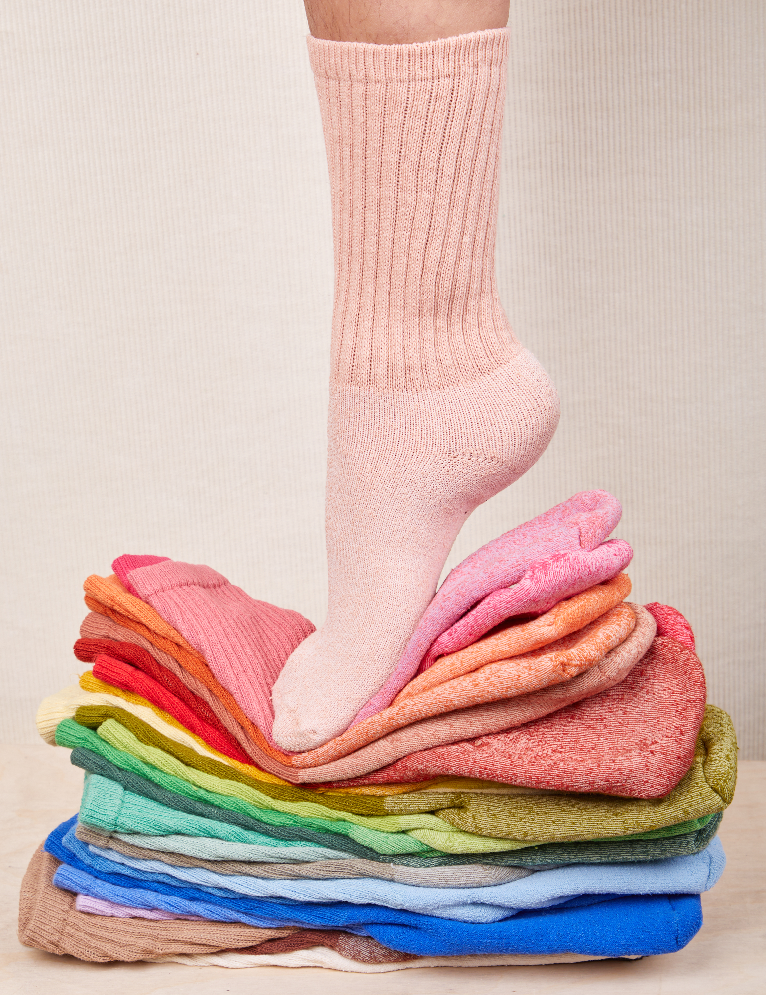 Thick Crew Sock in a rainbow of hues with baby pink on model