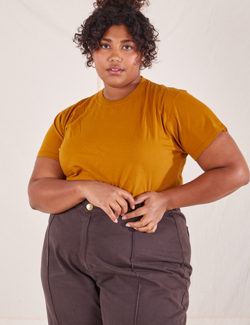 Morgan is wearing L Organic Vintage Tee in Spicy Mustard paired with espresso brown Western Pants