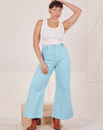Tiara is 5'4" and wearing XS Bell Bottoms in Baby Blue paired with baby blue Bell Bottoms