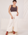 Tiara is 5'4" and wearing XS Bell Bottoms in Vintage Off-White paired with espresso brown Tank Top