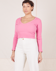 Tiara is wearing size S Long Sleeve V-Neck Tee in Bubblegum Pink paired with vintage off-white Western Pants