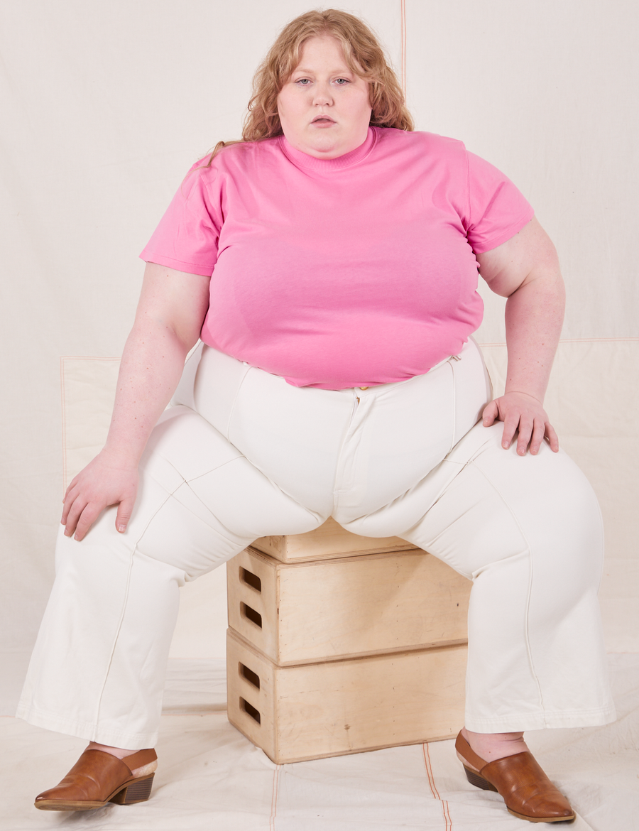 Catie is wearing 3XL The Organic Vintage Tee in Bubblegum Pink paired with vintage off-white Western Pants