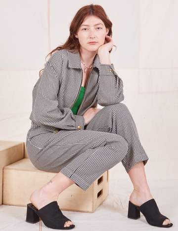Checker Trousers in Black & White on Alex wearing matching Ricky Jacket with forest green Tank Top underneath