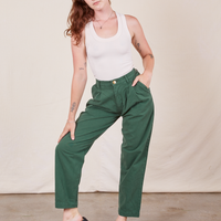Alex is 5'8" and wearing XXS Heavyweight Trousers in Dark Emerald Green paired with vintage off-white Tank Top