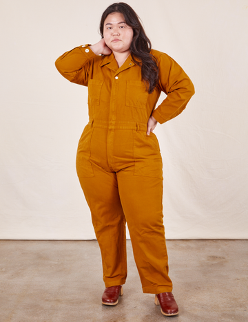 Ashley is 5'7" and wearing 1XL Everyday Jumpsuit in Spicy Mustard