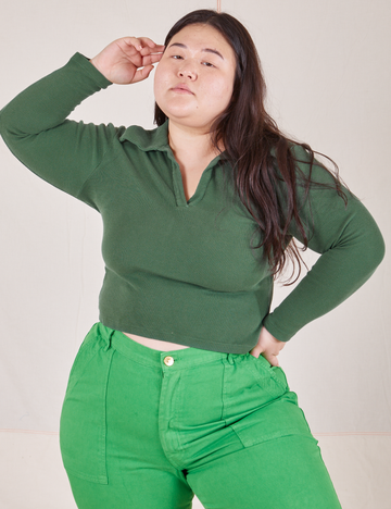Ashley is wearing size L Long Sleeve Fisherman Polo in Dark Emerald Green