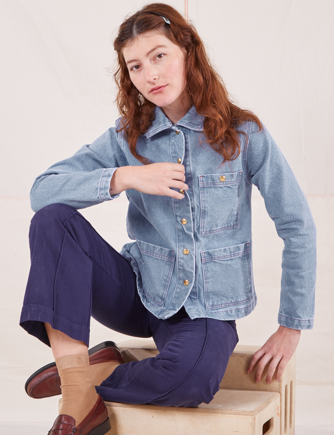 Alex is 5'8" and wearing XXS Indigo Denim Work Jacket in Light Wash paired with navy Western Pants