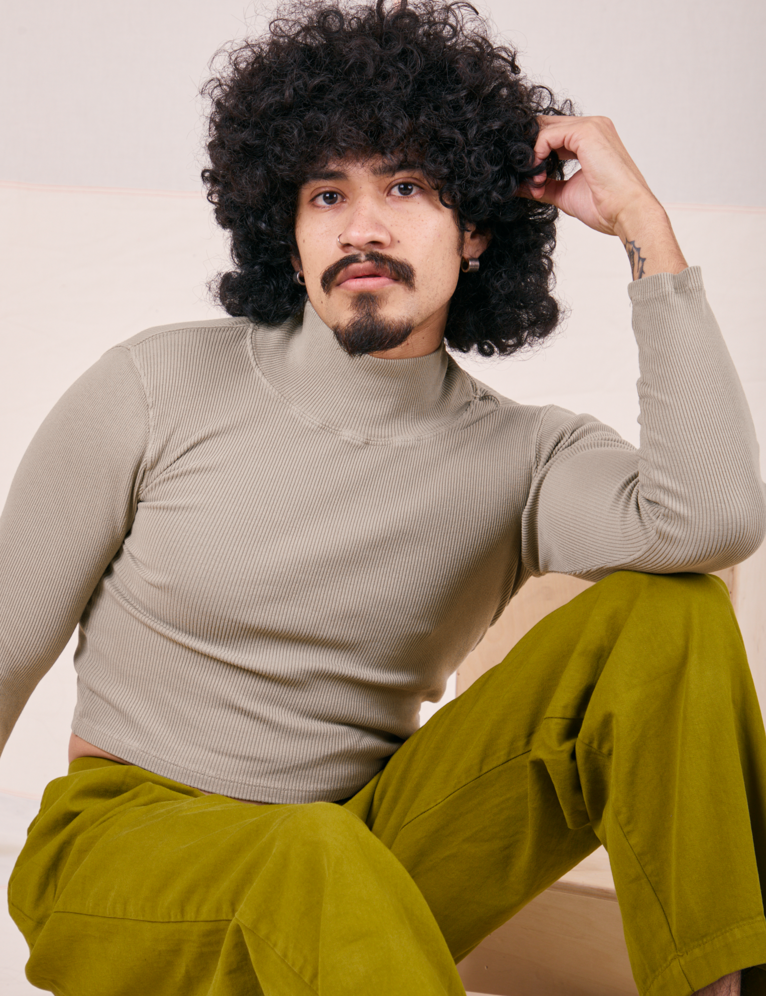 Jesse is 5’8” wearing XS Essential Turtleneck in Khaki Grey