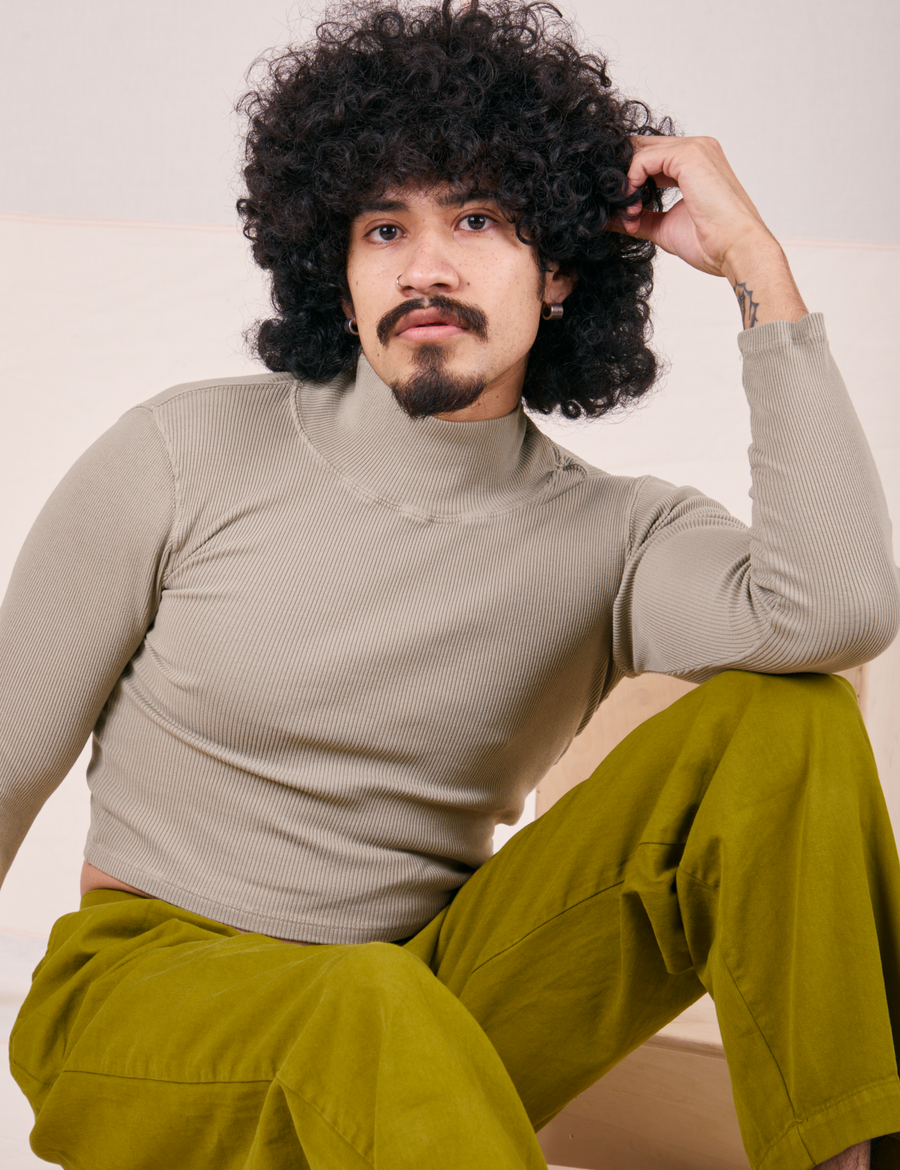 Jesse is 5’8” wearing XS Essential Turtleneck in Khaki Grey