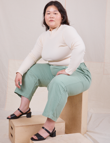 Ashley is wearing L Essential Turtleneck in Vintage Off-White