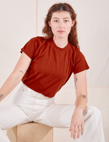Alex is wearing P Organic Vintage Tee in Paprika paired with vintage off-white Western Pants