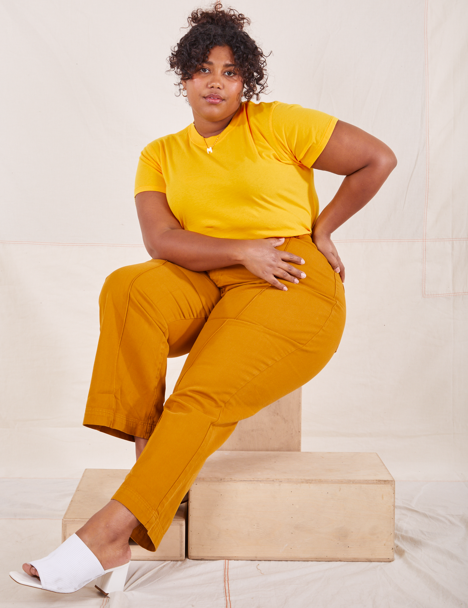 Morgan is wearing L Organic Vintage Tee in Sunshine Yellow paired with spicy mustard Western Pants