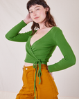 Alex is wearing size 1 Wrap Top in Bright Olive