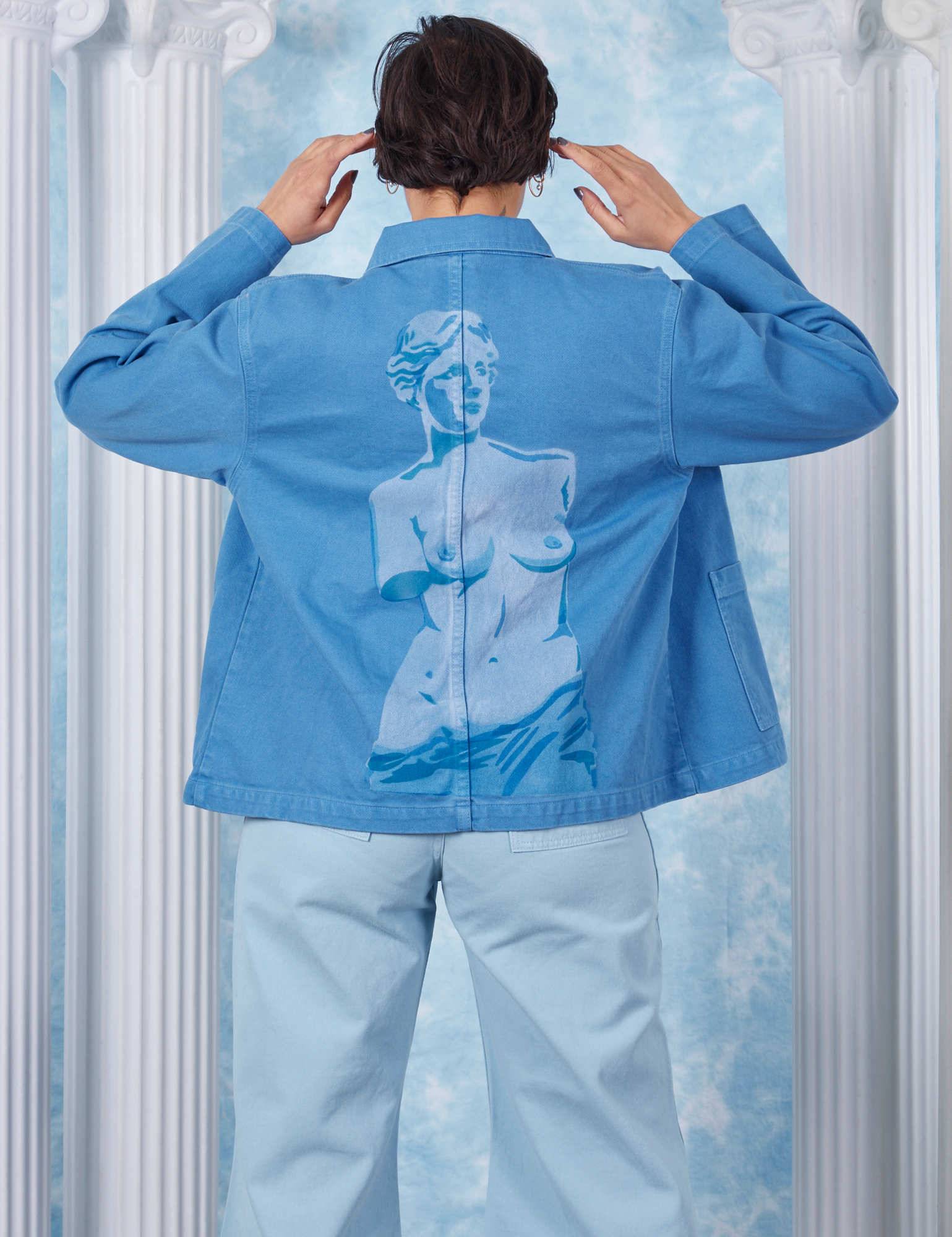 Tiara wearing XS Neoclassical Work Jacket in Blue Venus back view