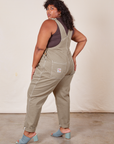 Angled back view of Original Overalls in Khaki Grey worn by Morgan