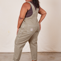 Angled back view of Original Overalls in Khaki Grey worn by Morgan
