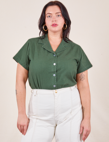 Faye is wearing M Pantry Button-Up in Dark Emerald Green tucked into vintage off-white Western Pants