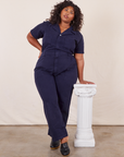 Morgan is 5'5" and wearing 2XL Short Sleeve Jumpsuit in Navy Blue