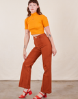 Alex is 5'8" and wearing XS Western Pants in Burnt Terracotta