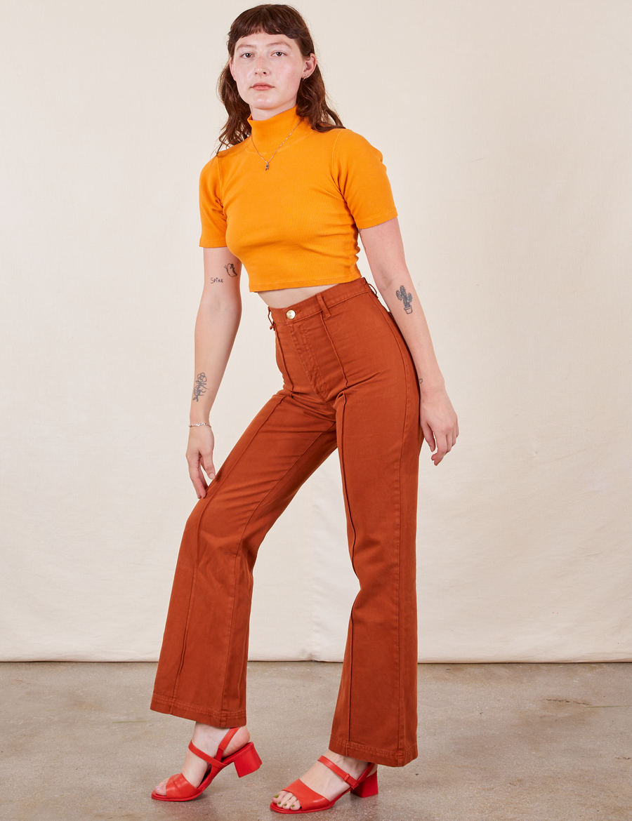 Western Pants in Burnt Terracotta on Alex wearing creamsicle orange 1/2 Sleeve Essential Turtleneck