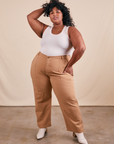 Morgan is 5'5" and wearing 3XL Work Pants in Tan paired with vintage off-white Tank Top