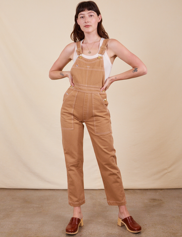 Alex is 5'8"and wearing P Original Overalls in Tan