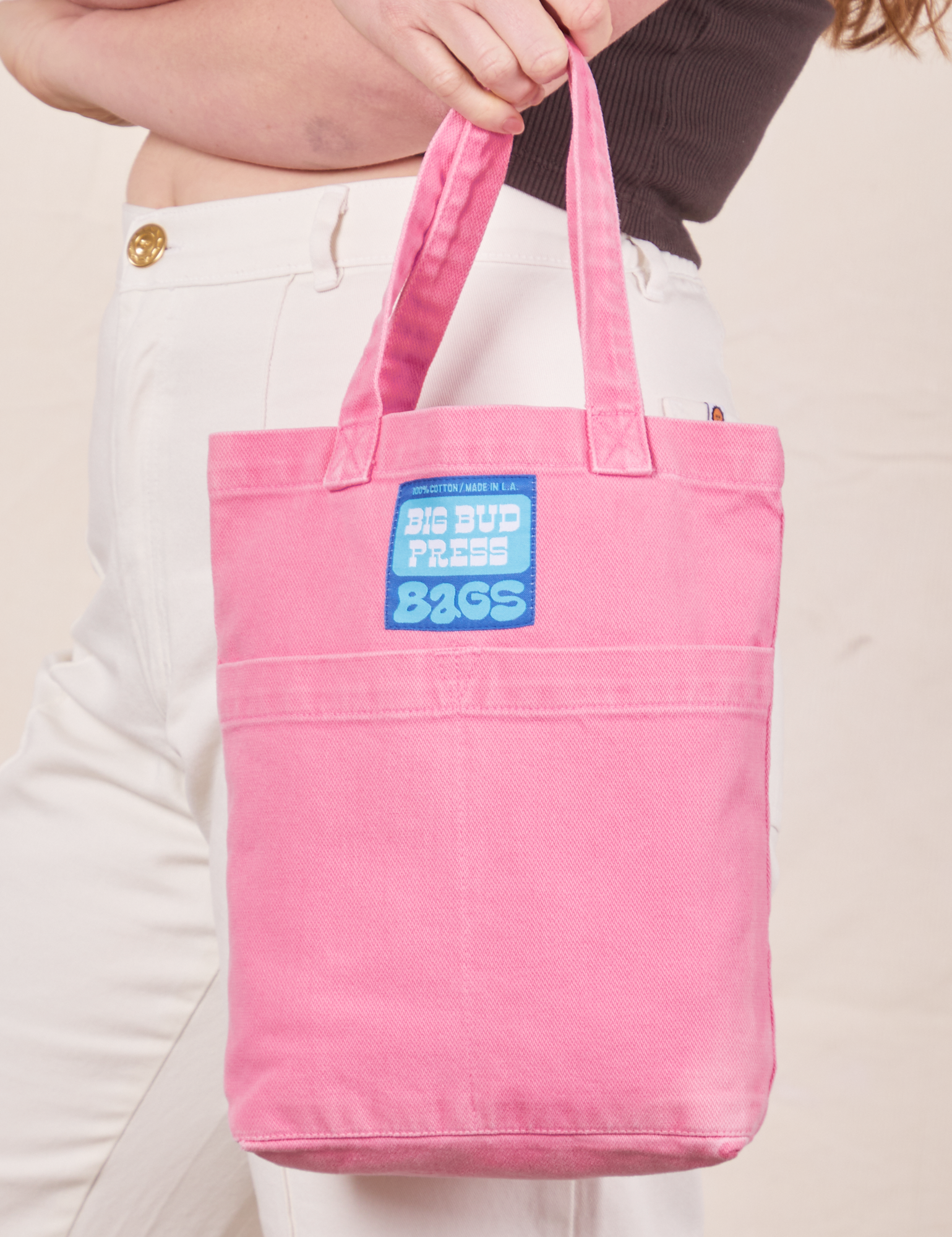Mini Tote Bags in Bubblegum Pink held by Allison