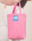 Mini Tote Bags in Bubblegum Pink held by Allison