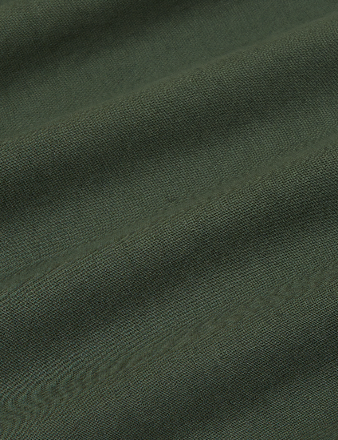 Pantry Button-Up in Dark Emerald Green fabric detail close up