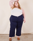 Catie is wearing Western Pants in Navy Blue and vintage off-white Tank Top