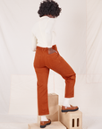 Back view of Organic Work Pants in Burnt Terracotta worn by Reece