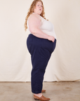 Side view of Western Pants in Navy Blue and vintage off-white Tank Top on Catie