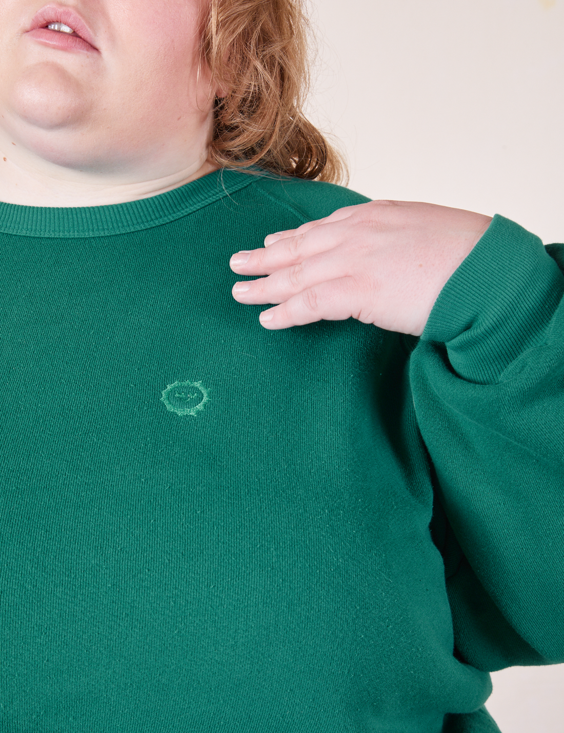 Front close up of Heavyweight Crew in Hunter Green worn by Catie