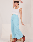 Tiara is wearing Bell Bottoms in Baby Blue and vintage off-white Tank Top