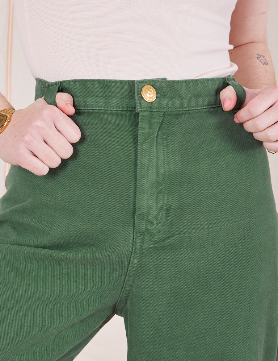 Front close up of Bell Bottoms in Dark Emerald Green worn by Hana