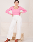 Tiara is wearing Long Sleeve V-Neck Tee in Bubblegum Pink and vintage off-white Western Pants
