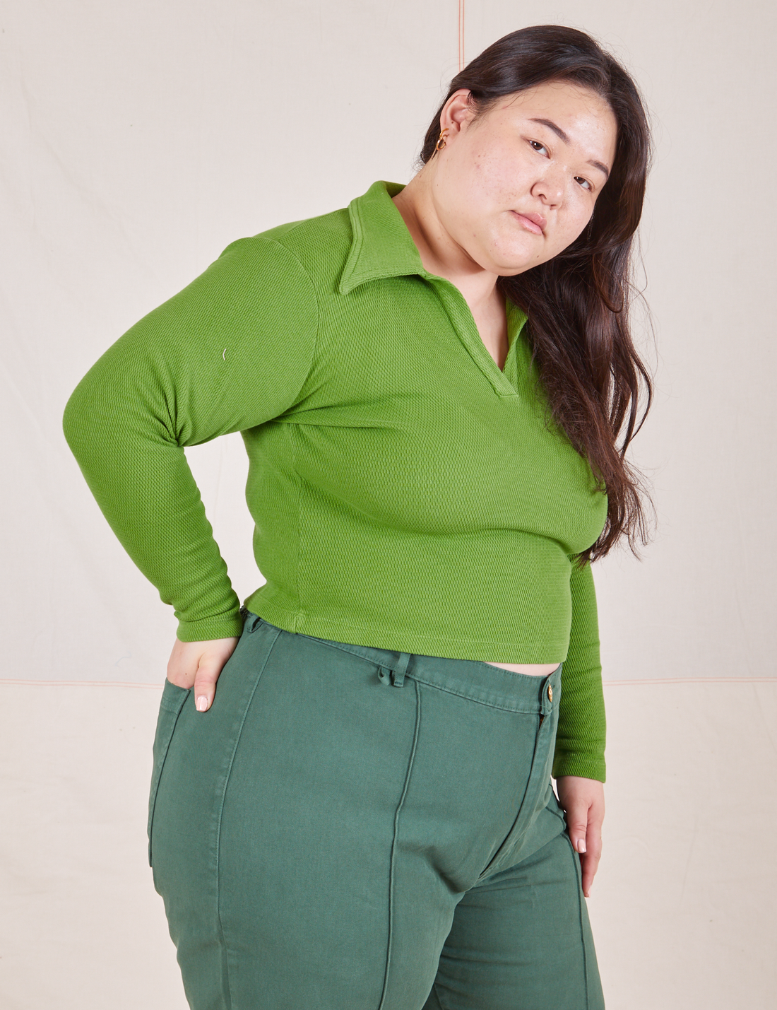 Long Sleeve Fisherman Polo in Bright Olive side view on Ashley wearing dark emerald green Western Pants