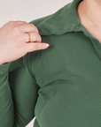 Front close up of Long Sleeve Fisherman Polo in Dark Emerald Green worn by Ashley