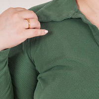 Long Sleeve Fisherman Polo in Dark Emerald Green front close up on Ashley
