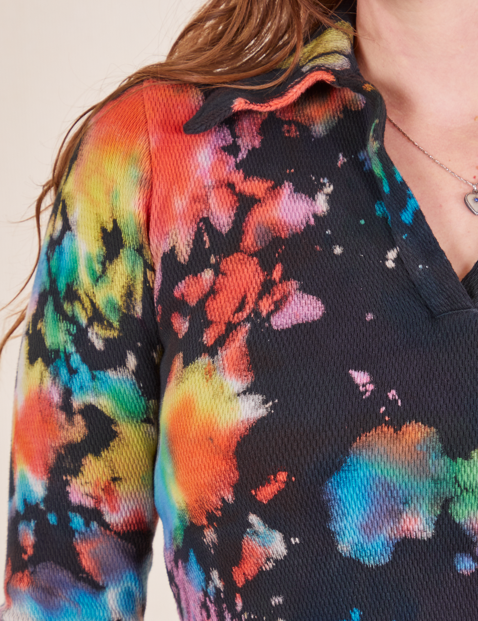 Front shoulder close up of Rainbow Magic Waters Long Sleeve Fisherman Polo worn by Allison