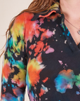 Front shoulder close up of Rainbow Magic Waters Long Sleeve Fisherman Polo worn by Allison