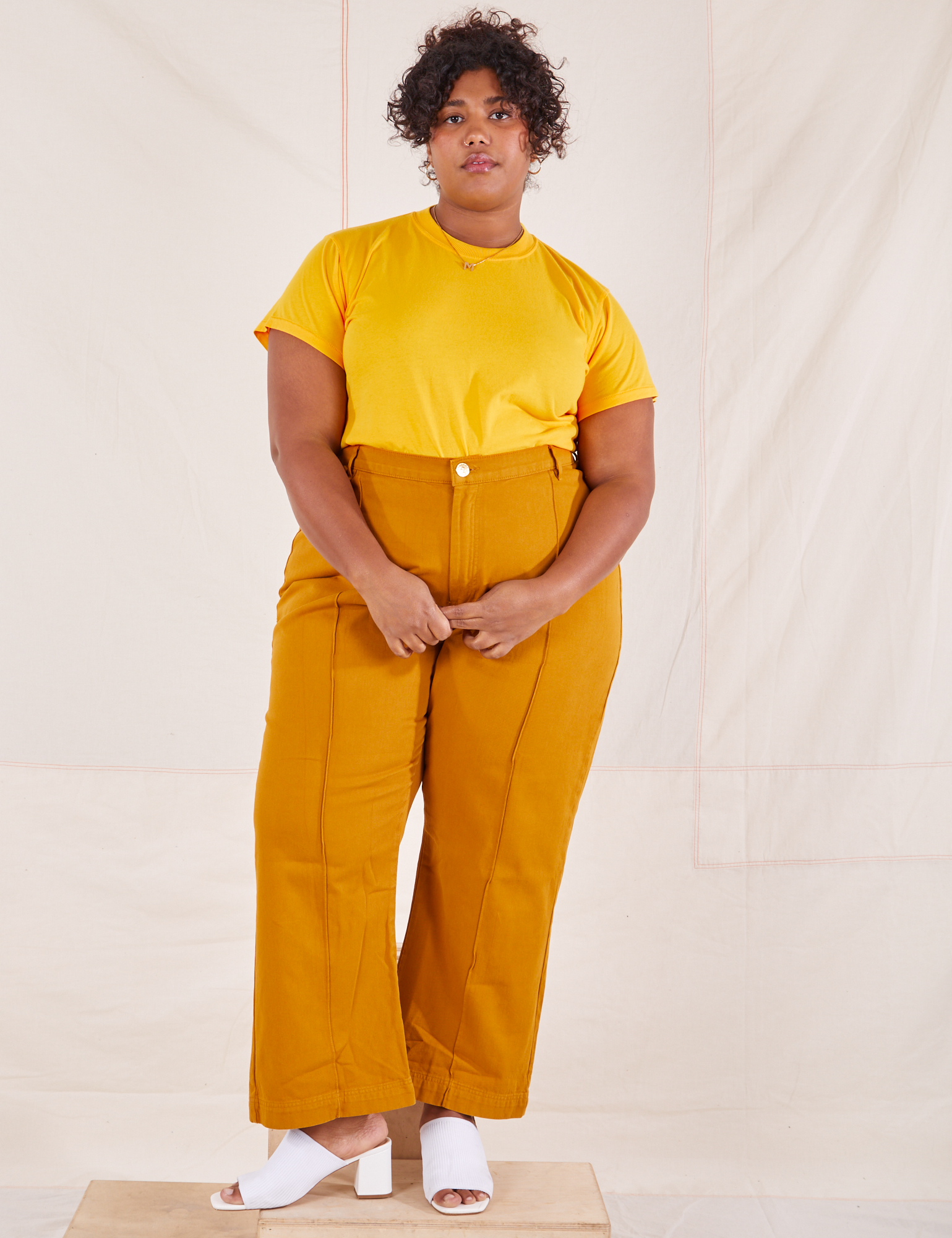 Morgan is wearing Organic Vintage Tee in Sunshine Yellow and spicy mustard Western Pants