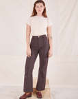 Alex is wearing P Organic Vintage Tee in Vintage Off-White paired with espresso brown Western Pants