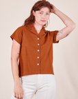 Alex is wearing Pantry Button-Up in Burnt Terracotta
