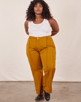 Morgan is wearing Western Pants in Spicy Mustard and vintage off-white Tank Top