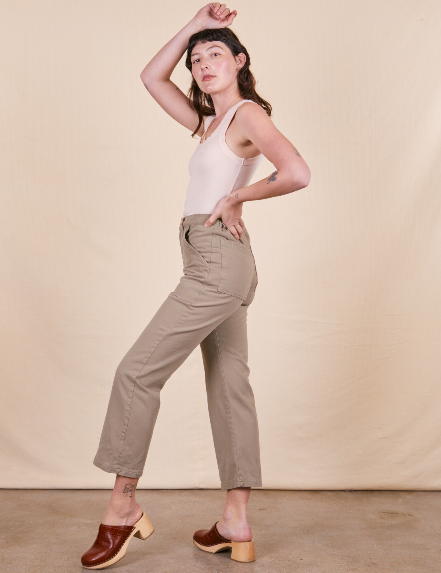 Side view of Work Pants in Khaki Grey and vintage off-white Tank Top on Alex
